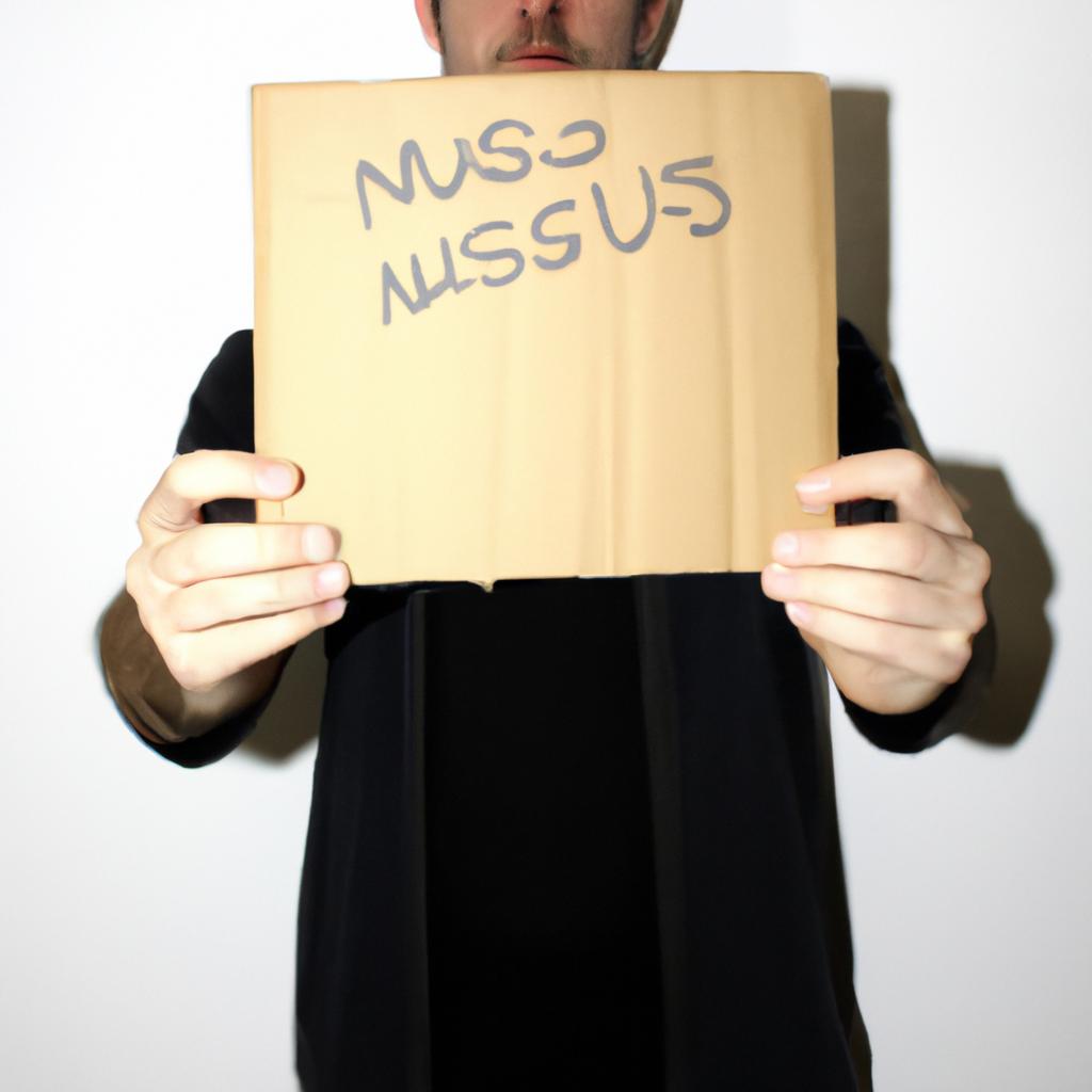 Person holding a cardboard sign